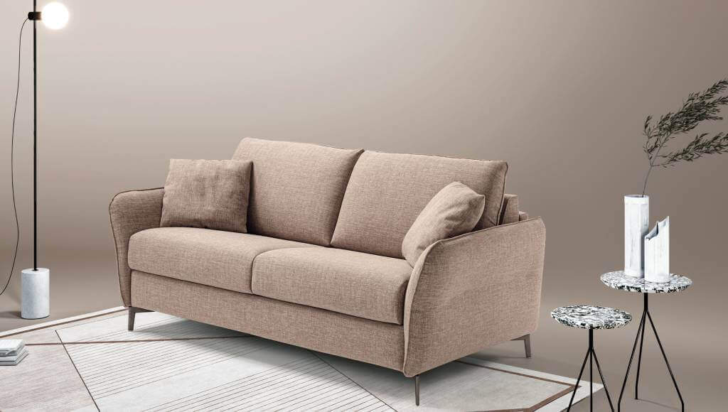 Elegance: il divano letto a una piazza e mezza con bracciolo compatto, inserito in una zona living moderna.
