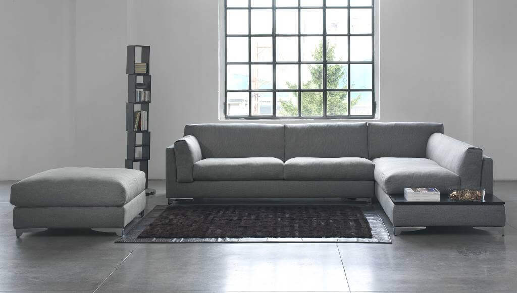 Soggiorno Con Divano Angolare. Comfort ed Eleganza Su Misura da Tino Mariani